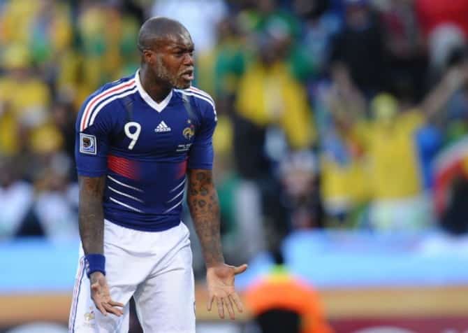 France's striker Djibril Cisse reacts during the Group A first round 2010 World Cup football match France vs. South Africa on June 22, 2010 at Free State Stadium in Mangaung/Bloemfontein .NO PUSH TO MOBILE / MOBILE USE SOLELY WITHIN EDITORIAL ARTICLE - AFP PHOTO / VINCENZO PINTO