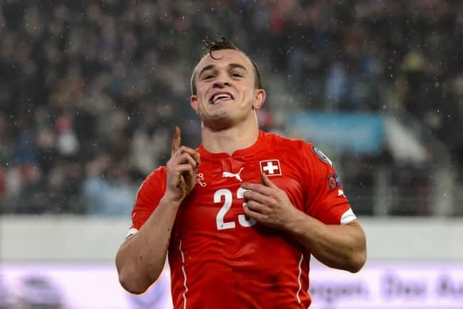 Switzerland's midfielder Xherdan Shaqiri celebrates after scoring the team's third goal during an Euro 2016 Group E qualifying match Switzerland against Lithuania at the AFG Arena on November 15, 2014 in St Gallen. AFP PHOTO / FABRICE COFFRINI